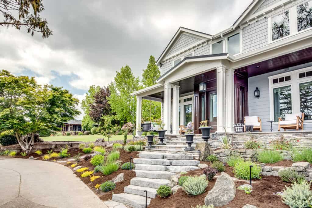 Front porch of new custom home in Vancouver WA featuring covered porch and stone stairs.